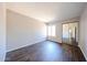 Bright and airy bedroom with hardwood floors, a window and mirrored closet doors at 747 S Extension Rd # 115, Mesa, AZ 85210