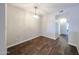 Dining room with hardwood floors and a contemporary light fixture at 747 S Extension Rd # 115, Mesa, AZ 85210
