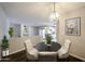 Elegant dining area with stylish chairs, dark wood table, and decor at 747 S Extension Rd # 115, Mesa, AZ 85210