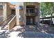Exterior of apartment building with stairs and covered parking in the background at 747 S Extension Rd # 115, Mesa, AZ 85210