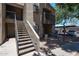 Exterior of apartment building with stairs and covered parking in the background at 747 S Extension Rd # 115, Mesa, AZ 85210