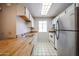 Kitchen with white cabinets, wood countertop and stainless steel appliances at 747 S Extension Rd # 115, Mesa, AZ 85210