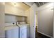 Laundry room featuring washer, dryer, and shelving at 747 S Extension Rd # 115, Mesa, AZ 85210