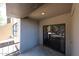 View of the patio featuring sliding glass doors and textured concrete flooring at 747 S Extension Rd # 115, Mesa, AZ 85210