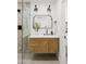 Modern bathroom featuring a shower with unique tiling, a floating vanity, and modern fixtures at 7620 N 12Th Pl, Phoenix, AZ 85020