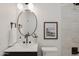 Modern bathroom featuring a shower over the tub with white tile and matte black hardware at 7620 N 12Th Pl, Phoenix, AZ 85020