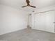 Bedroom featuring tile floors and large closet with sliding doors at 7620 N 12Th Pl, Phoenix, AZ 85020