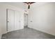 Bedroom featuring tile floors, large closet, and access to an adjacent room at 7620 N 12Th Pl, Phoenix, AZ 85020