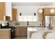 Bright kitchen features stainless steel appliances, gas range, and light wood cabinetry at 7620 N 12Th Pl, Phoenix, AZ 85020