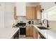 Stylish kitchen featuring stainless steel gas range and ample counter space at 7620 N 12Th Pl, Phoenix, AZ 85020