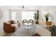 Bright living room features contemporary furnishings, a large window, and neutral color palette at 7620 N 12Th Pl, Phoenix, AZ 85020