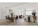 Open-concept living and dining area with modern furnishings and neutral color scheme at 7620 N 12Th Pl, Phoenix, AZ 85020