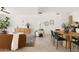 Open living space with modern decor, a dining area, and tile flooring at 7620 N 12Th Pl, Phoenix, AZ 85020