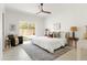 Bright main bedroom with tile floors, a ceiling fan, and backyard access at 7620 N 12Th Pl, Phoenix, AZ 85020