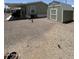 Spacious backyard area with gravel and storage shed with room to add your own personal touches at 7807 E Main St # Cc-98, Mesa, AZ 85207