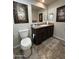 Bathroom with dark vanity, neutral wall color, decorative art, and tile flooring at 7807 E Main St # Cc-98, Mesa, AZ 85207