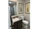 Cozy bathroom featuring tile flooring, dark vanity, and decorative accents at 7807 E Main St # Cc-98, Mesa, AZ 85207