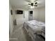 Neutral bedroom featuring a ceiling fan, closet door, dresser and tv at 7807 E Main St # Cc-98, Mesa, AZ 85207
