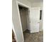Hall closet featuring wire shelving with tile floors and a white door at 7807 E Main St # Cc-98, Mesa, AZ 85207