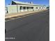 Community building with ample parking spaces and a covered entryway for events and activities at 7807 E Main St # Cc-98, Mesa, AZ 85207