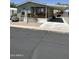 Charming home with covered front porch and carport area and low maintenance landscaping at 7807 E Main St # Cc-98, Mesa, AZ 85207