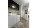 Bright laundry room with upper cabinets and tile flooring at 7807 E Main St # Cc-98, Mesa, AZ 85207