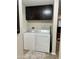 Laundry area with washer, dryer, and dark cabinets at 7807 E Main St # Cc-98, Mesa, AZ 85207