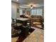 Open concept living area featuring tile floors and neutral tones, ceiling fan, and bright windows at 7807 E Main St # Cc-98, Mesa, AZ 85207