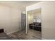 This bedroom offers wood-look floors and a mirrored closet with sliding doors at 8042 W Mariposa Dr, Phoenix, AZ 85033