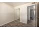 Bedroom featuring wood-look floors and a mirrored closet with sliding doors at 8042 W Mariposa Dr, Phoenix, AZ 85033