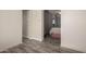 View of bedroom featuring tiled floors, neutral walls, and a glimpse of the adjoining bathroom at 8042 W Mariposa Dr, Phoenix, AZ 85033