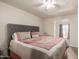Bedroom with modern decor, a padded headboard and view to the outdoor patio at 8042 W Mariposa Dr, Phoenix, AZ 85033