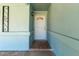 An inviting front door enhanced by decorative details and complementary sidelights at 8042 W Mariposa Dr, Phoenix, AZ 85033