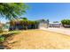 Charming single-story home with a well-maintained lawn and a cozy, covered porch entrance at 8042 W Mariposa Dr, Phoenix, AZ 85033