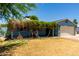 Charming single-story home with a well-maintained lawn and a cozy, covered porch entrance at 8042 W Mariposa Dr, Phoenix, AZ 85033