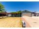 Charming single-story home with a well-maintained lawn and a cozy, covered porch entrance at 8042 W Mariposa Dr, Phoenix, AZ 85033