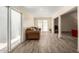 Spacious living room featuring sliding glass doors and wood-look tile flooring for a modern aesthetic at 8042 W Mariposa Dr, Phoenix, AZ 85033