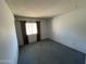 Bedroom featuring a window with curtains and blue carpet at 8114 E Jackrabbit Rd, Scottsdale, AZ 85250