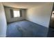 Bedroom featuring a window with curtains and blue carpet at 8114 E Jackrabbit Rd, Scottsdale, AZ 85250