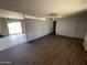 View of a spacious living room with connecting room featuring sliding glass doors to the backyard at 8114 E Jackrabbit Rd, Scottsdale, AZ 85250