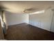 Spacious living room features a ceiling fan and a partial view of the other room at 8114 E Jackrabbit Rd, Scottsdale, AZ 85250