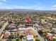 An aerial view of a neighborhood with a red arrow indicating a specific property, showcasing its location and surroundings at 8604 S Oak St, Tempe, AZ 85284
