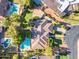 Expansive aerial view of a luxurious property featuring lush landscaping, a private pool, and an elegant roofline at 8604 S Oak St, Tempe, AZ 85284