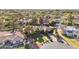 An eye-level view captures a gorgeous private residence with lush green landscaping, a long driveway, and a manicured lawn at 8604 S Oak St, Tempe, AZ 85284