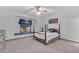 Bedroom with a window seat and a four poster bed at 8604 S Oak St, Tempe, AZ 85284
