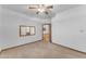 Bedroom with neutral carpet, open door and a mirror on the wall at 8604 S Oak St, Tempe, AZ 85284