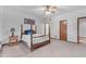 Bedroom with four poster bed, neutral carpet, and ceiling fan at 8604 S Oak St, Tempe, AZ 85284