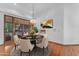 Elegant dining area with stylish round table set and access to outdoor pool patio, perfect for entertaining at 8604 S Oak St, Tempe, AZ 85284