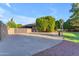 Spacious driveway leading to a gated property with mature landscaping and well-maintained exteriors at 8604 S Oak St, Tempe, AZ 85284