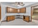 Versatile flex room with cabinets and countertops providing great function, ceiling fan, and natural light at 8604 S Oak St, Tempe, AZ 85284